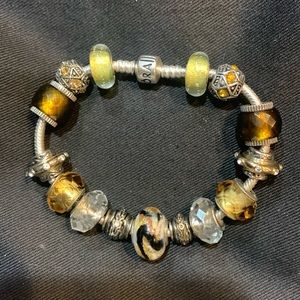 Pandora 8 inch bracelet with 15 charms. Barrel closure.